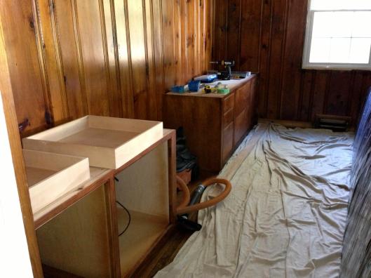 The base cabinets in place.  The restored paneling would also serve as the back of the upper bookcases.