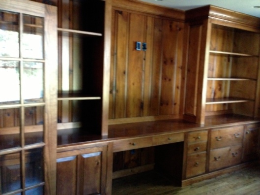 The nearly complete wall unit, artfully integrated with the newly restored original pine paneling.